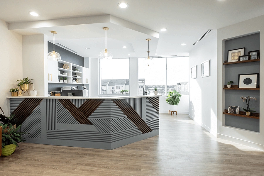 Dental office front desk and reception area at Joanna Claustro DMD & Associates